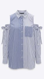 Chemise féminine à rayures bleues et blanches, épaules dénudées avec détails noués aux manches